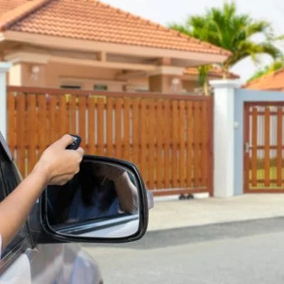 Remote control garage door automation system with wooden vertical-slat gate